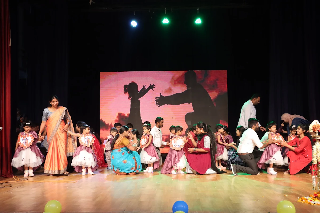 Teachers and children connecting warmly at Star Kids Kingdom event